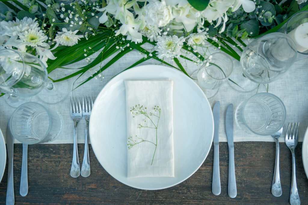 Jasmine Wedding Table Decor Setup at Kala Bahia Sophisticated jasmine-themed wedding table setup at Kala Bahia, an oceanfront wedding venue in South Goa, featuring fresh jasmine flowers and elegant tropical styling.