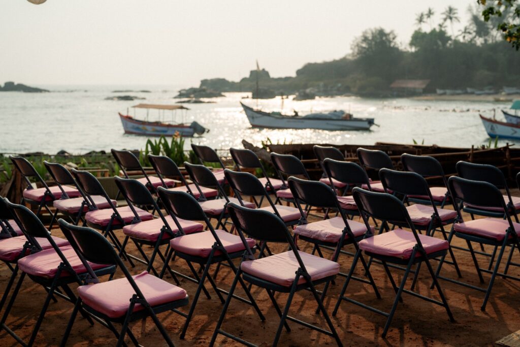 Oceanfront Wedding Ceremony Chair Setup at Kala Bahia Elegant chair arrangement for a wedding vow ceremony overlooking the Arabian Sea at Kala Bahia, a stunning sea-facing wedding venue in South Goa near Palolem Beach.