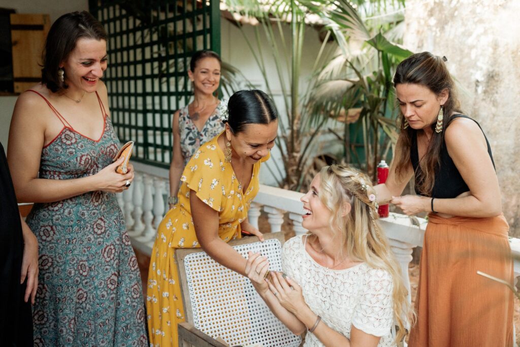 Bride Getting Ready with Bridesmaid at Kala Bahia Bride getting ready with the help of her bridesmaid before a beachside wedding at Kala Bahia, a stunning South Goa wedding venue near Palolem Beach.