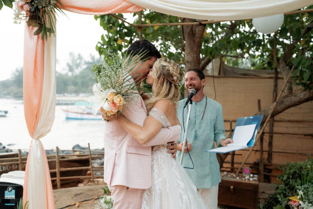 Amy & Andrey’s First Kiss at Their South Goa Beachside Wedding Amy and Andrey share their first kiss as a married couple at Kala Bahia, a stunning beachside wedding venue in South Goa near Palolem Beach.