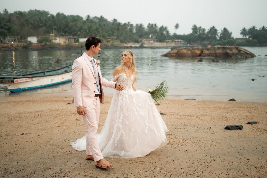 Amy & Andrey Wedding Portrait with Ocean View at Kala Bahia Bride and groom portrait of Amy and Andrey with the scenic backdrop of Colomb Bay at Kala Bahia, an oceanfront wedding venue near Palolem Beach in South Goa.